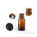 Botella de vidrio de aceite esencial de color ámbar con manipulación